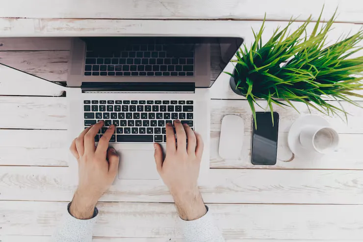 Businessman Working on Laptop Wallpaper.avif